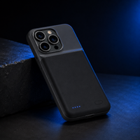 XAVREON battery case next to iPhone, dark studio lighting